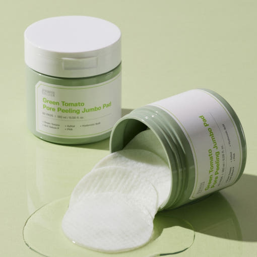 ThatKBeautyShop.com SUNGBOON EDITOR | Green Tomato Pore Peeling Jumbo Pads Green Tomato Pore Peeling Jumbo Pad container with pads spilling out on a light green background