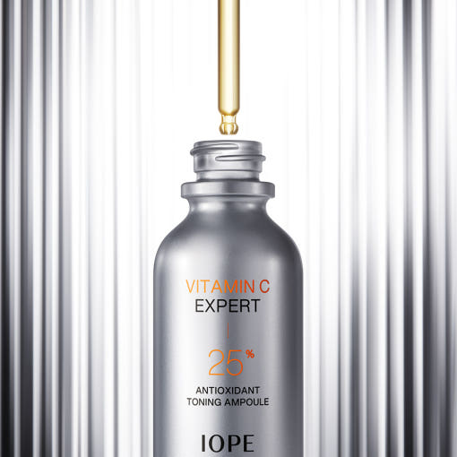 IOPE Vitamin C Expert Ampoule bottle on a gray background AgelessBeauty3000.com IOPE | Vitamin C Expert 25% Antioxidant Toning Ampoule