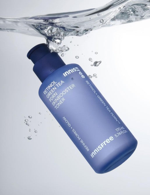 ThatKBeautyShop.com Blue bottle of Innisfree toner with water splash on a light gray background