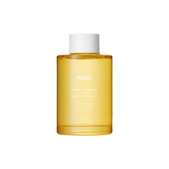 Yellow bottle with white cap on a white background  AgelessBeauty3000.com  Huxley  |  Body Oil in Moroccan Gardener
