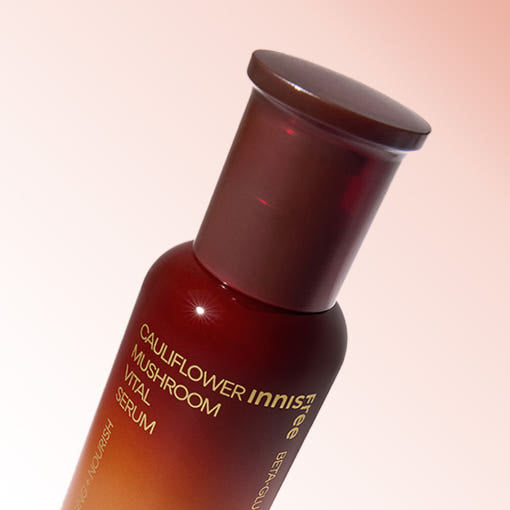 AgelessBeauty3000.com  Innisfree  | Cauliflower Mushroom Vital Serum     Cauliflower Mushroom Vital Serum bottle with gradient design on a light pink background