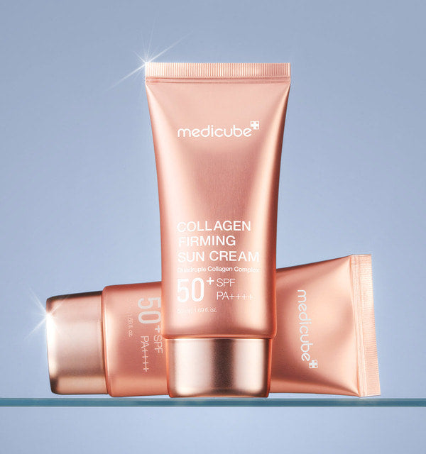 AgelessBeauty3000.com  medicube | Collagen Firming Sun Cream  Medicube Collagen Firming Sun Cream SPF50+ PA++++ on a light blue background