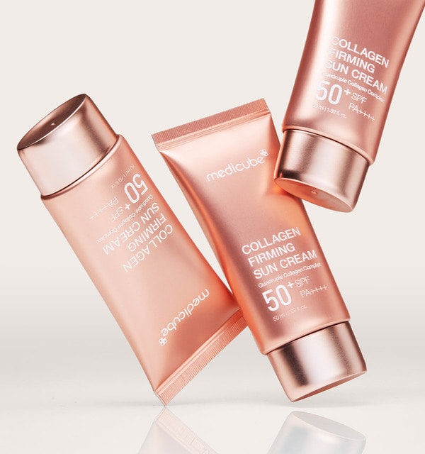 AgelessBeauty3000.com  medicube | Collagen Firming Sun Cream  Three bottles of Mediclean Collagen Firming Sun Cream on a light background