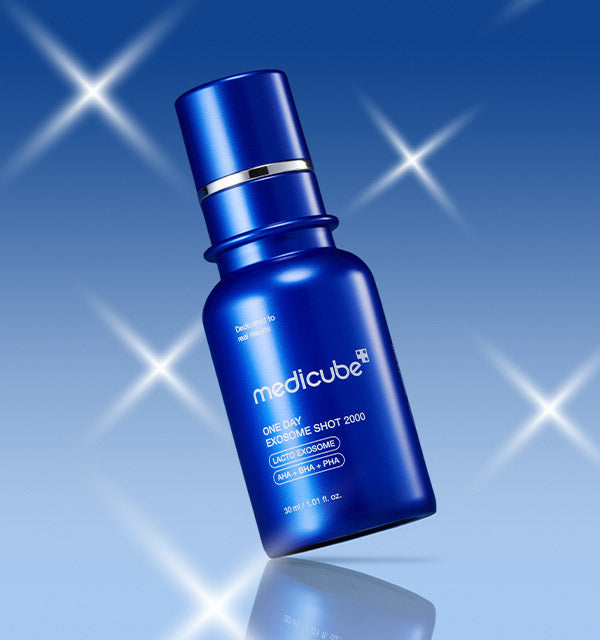 AgelessBeauty3000.com  medicube |One Day Exosome Shot Pore Ampoule 2000  Blue Medicube serum bottle on a blue background with starlight effects