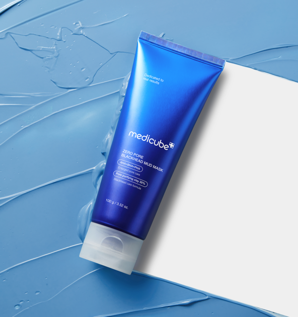 AgelessBeauty3000.com  medicube | Zero Pore Blackhead Mud Mask  Blue tube of Medicube product on a blue textured background