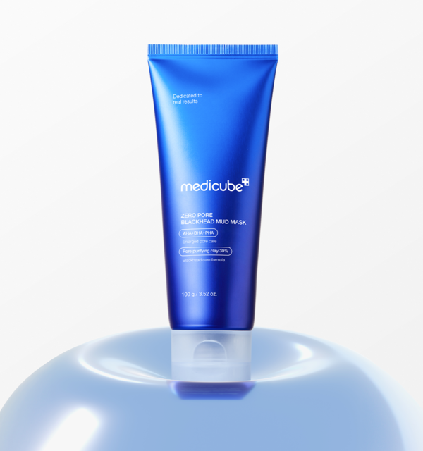 AgelessBeauty3000.com  medicube | Zero Pore Blackhead Mud Mask  Blue tube of Medicube product on a reflective surface with a white background