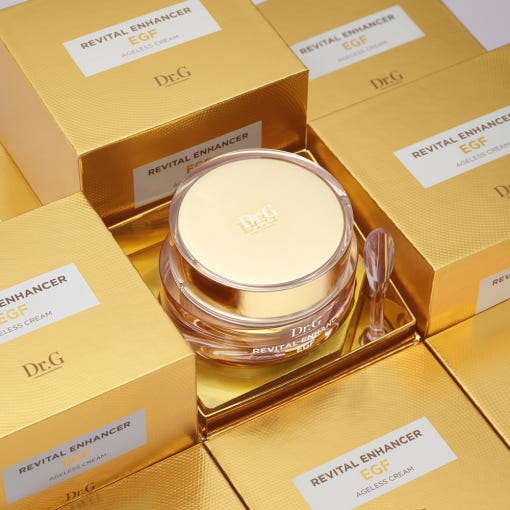AgelessBeauty3000.com  Dr.G | Revital Enhancer EGF Ageless Cream    Gold cosmetic jar with lid on a matching gold background