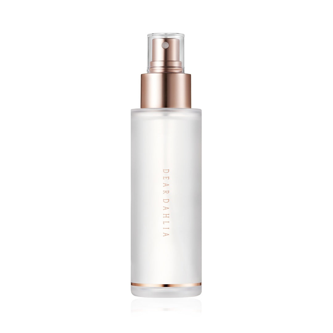 Skincare bottle with rose gold cap and base on a white background  AgelessBeautz3000.com  DEAR DAHLIA |  Endless Skin Setting Spray