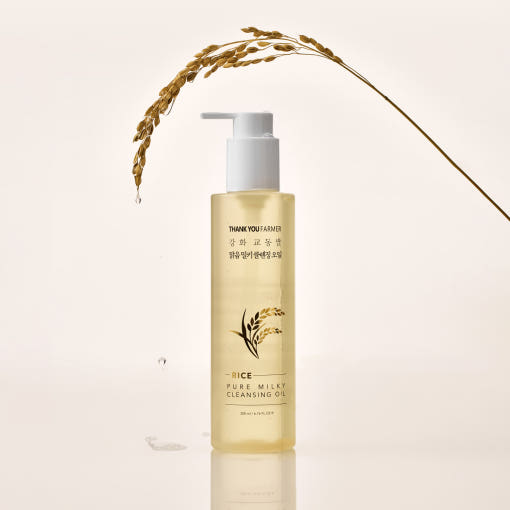 Agelessbeauty3000.com THANK YOU FARMER  | Rice Pure Milky Cleansing Oil Skincare bottle labeled 'Rice Pure Milky Cleansing Oil' with a stalk of rice on a light beige background