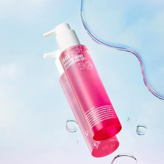 AgelessBeauty3000.com  isoi  | Brightening Cleansing Oil Pink bottle of cleansing oil with a white pump on a light blue background
