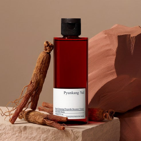 AgelessBeauty3000.com Pyunkang Yul | Red Ginseng Propolis Booster Toner
  Red bottle of Pyunkang Yul product with dried roots on a neutral background