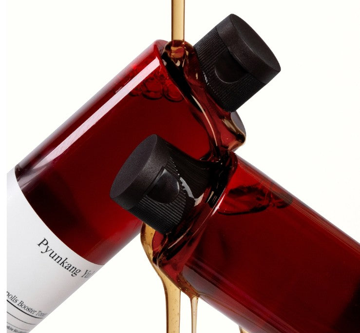 AgelessBeauty3000.com Pyunkang Yul | Red Ginseng Propolis Booster Toner
  Red bottle with black cap and white label, pouring liquid.